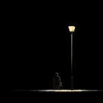 man, sitting, lamppost, lamp, post, light, dark, night, alone, silhouette, chair, person, solitude, mystery, shadow, urban, loneliness, thoughtful, pensive, contemplation, quiet, evening, outside, outdoors, ai generated